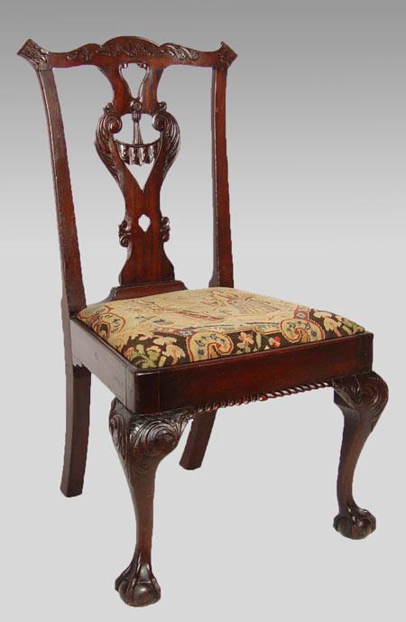 Appraisal: A CHIPPENDALE CARVED MAHOGANY SIDE CHAIR Carved backsplat garcons edging