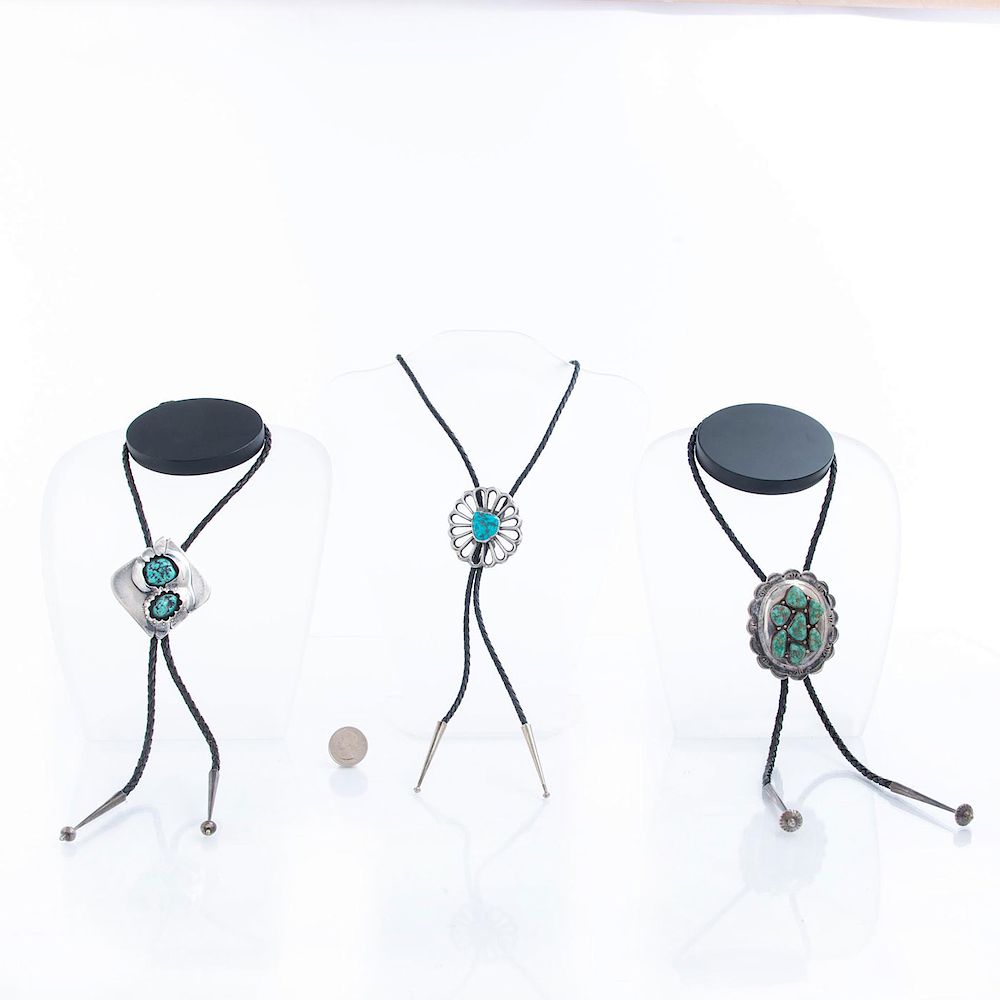 Appraisal: NATIVE AMERICAN SILVER AND TURQUOISE BOLO TIES Hallmarked silver on