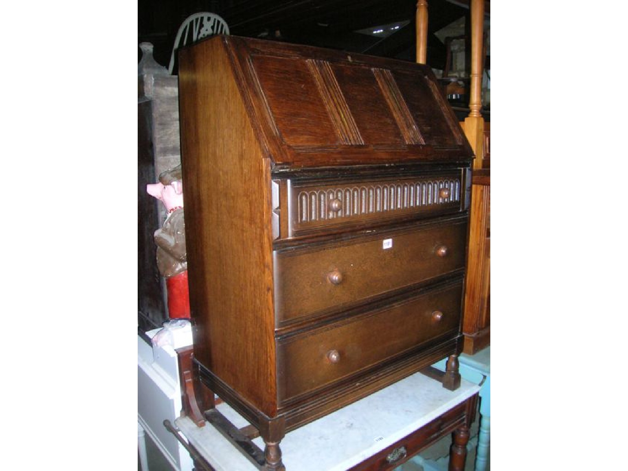 Appraisal: A reproduction oak bureau possibly Jaycee or Old Charm the