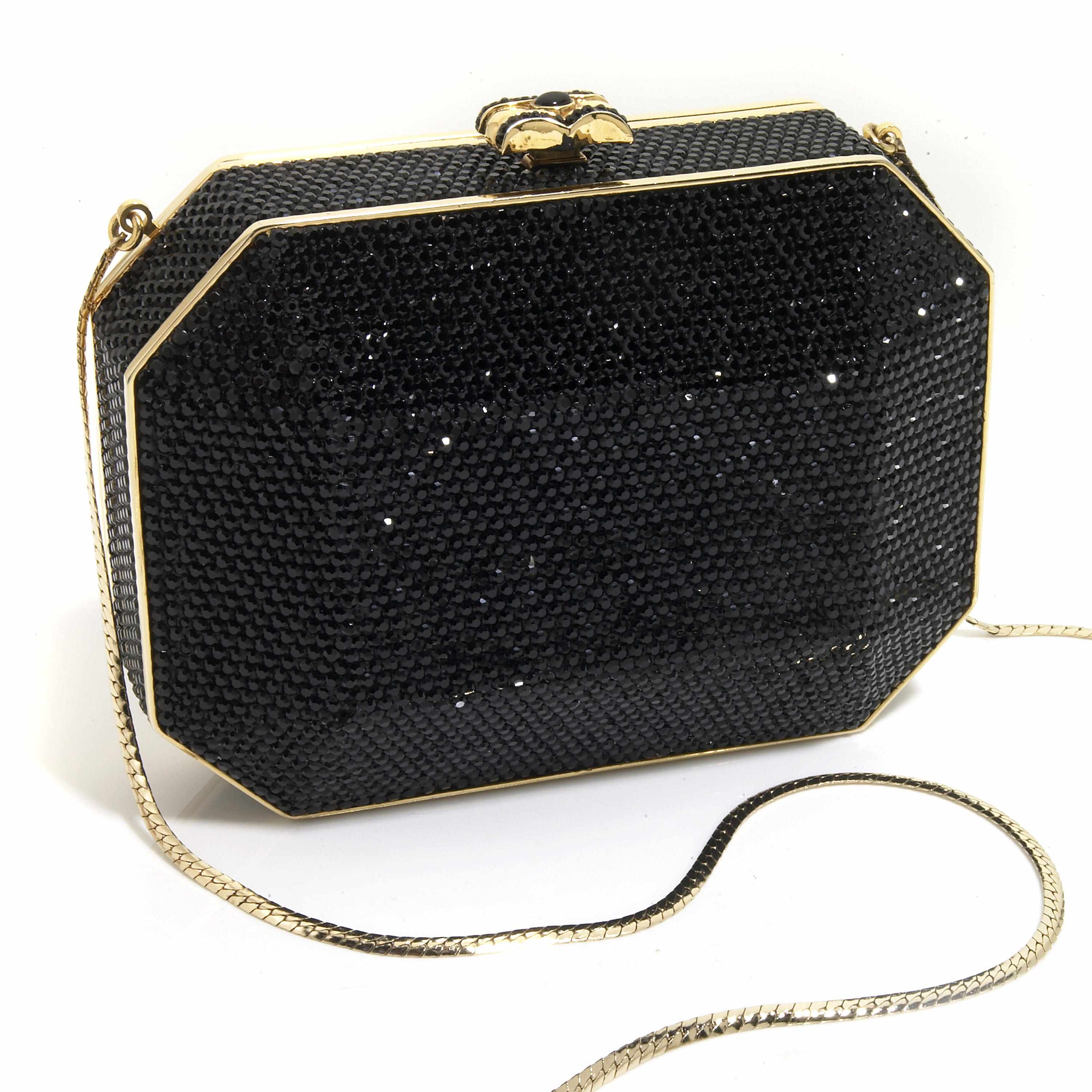 Appraisal: A bulged black crystal and gold colored metal detailing purse