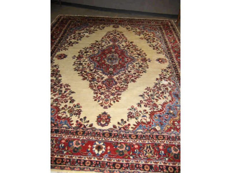 Appraisal: QAZVIN ROOM RUG The ivory field shows an oversized floral