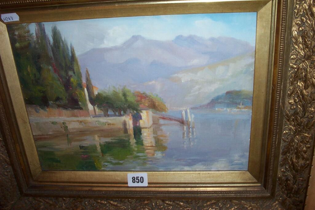 Appraisal: An oil painting on board of a continental lake scene