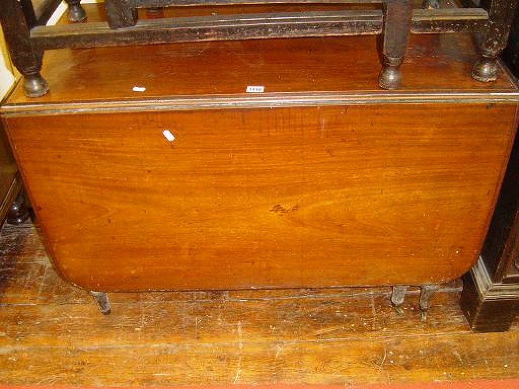 Appraisal: A Victorian mahogany drop leaf dining table with moulded edge