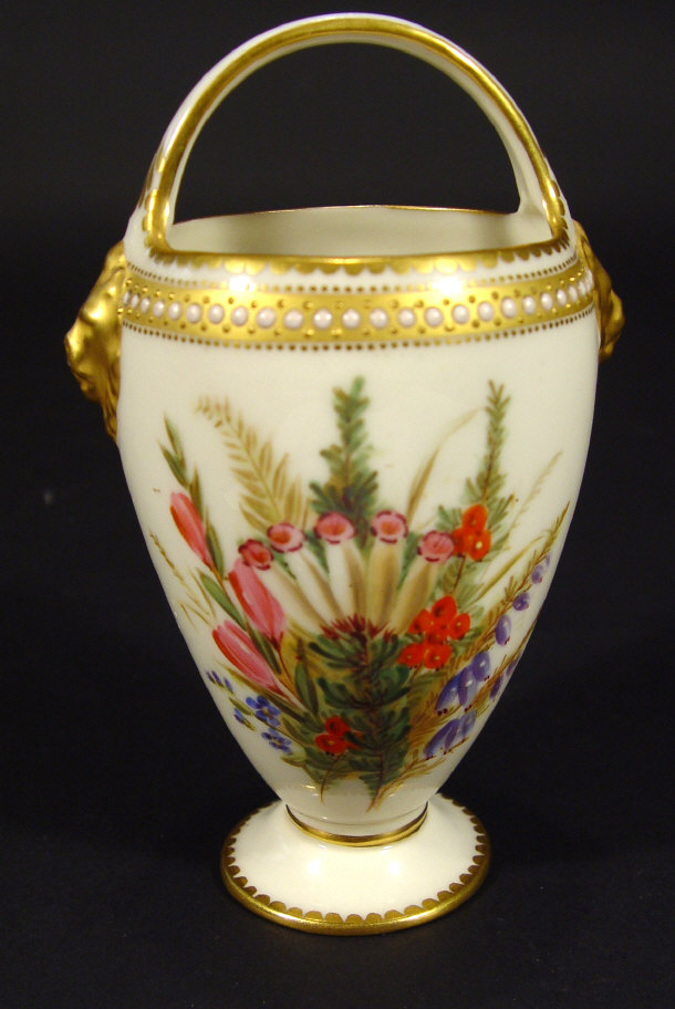 Appraisal: Royal Worcester china basket with lion mask handle painted to