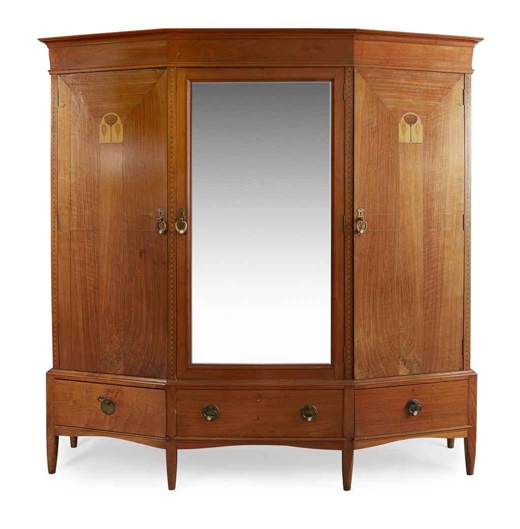 Appraisal: ARTS CRAFTS MAHOGANY WARDROBE CIRCA with central mirrored door flanked