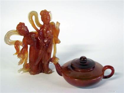 Appraisal: Two Chinese carved orange quartz table articlesComprising a figural grouping