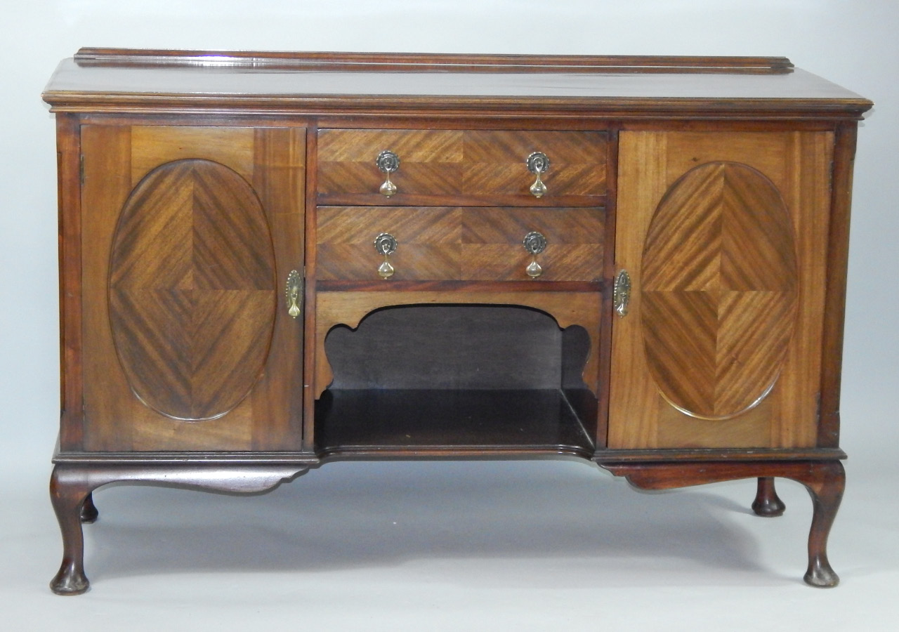 Appraisal: A 's mahogany sideboard with two frieze drawers flanked by