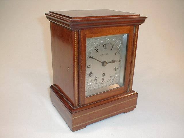 Appraisal: An Edwardian string inlaid mahogany bracket clock with eight day