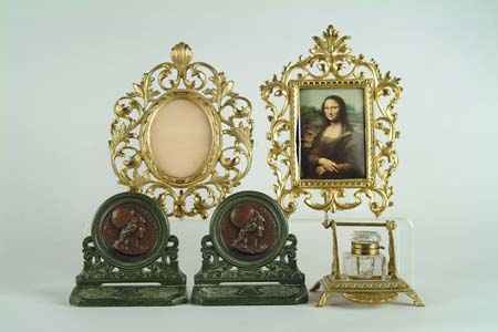 Appraisal: TWO BRASS PICTURE FRAMES INKWELL AND PAIR OF MINERVA BOOKENDS