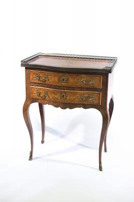 Appraisal: A French walnut and inlaid serpentine front bedside table the