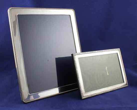 Appraisal: An Edwardian silver mounted rectangular photograph frame with reeded and