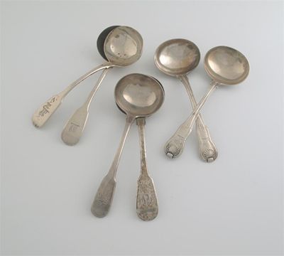 Appraisal: A George III fiddle sauce ladle three similar George IV