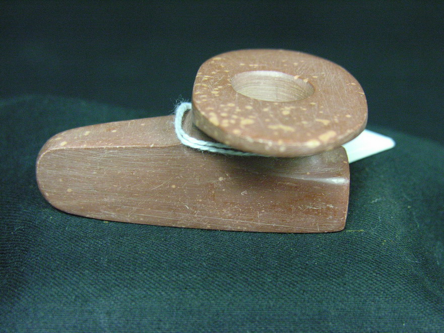 Appraisal: NATIVE AMERICAN CATLINITE DISC PIPE Red catlinite drilled pipe bowl