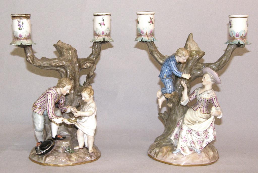 Appraisal: Pair of Meissen twin branch figural candlesticks the branches modelled