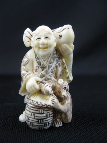 Appraisal: Carved Ivory Netsuke of a Manwith large fish on his