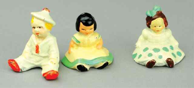 Appraisal: SEATED CHILDREN PAPERWEIGHTS Cast amusing depiction of three children in