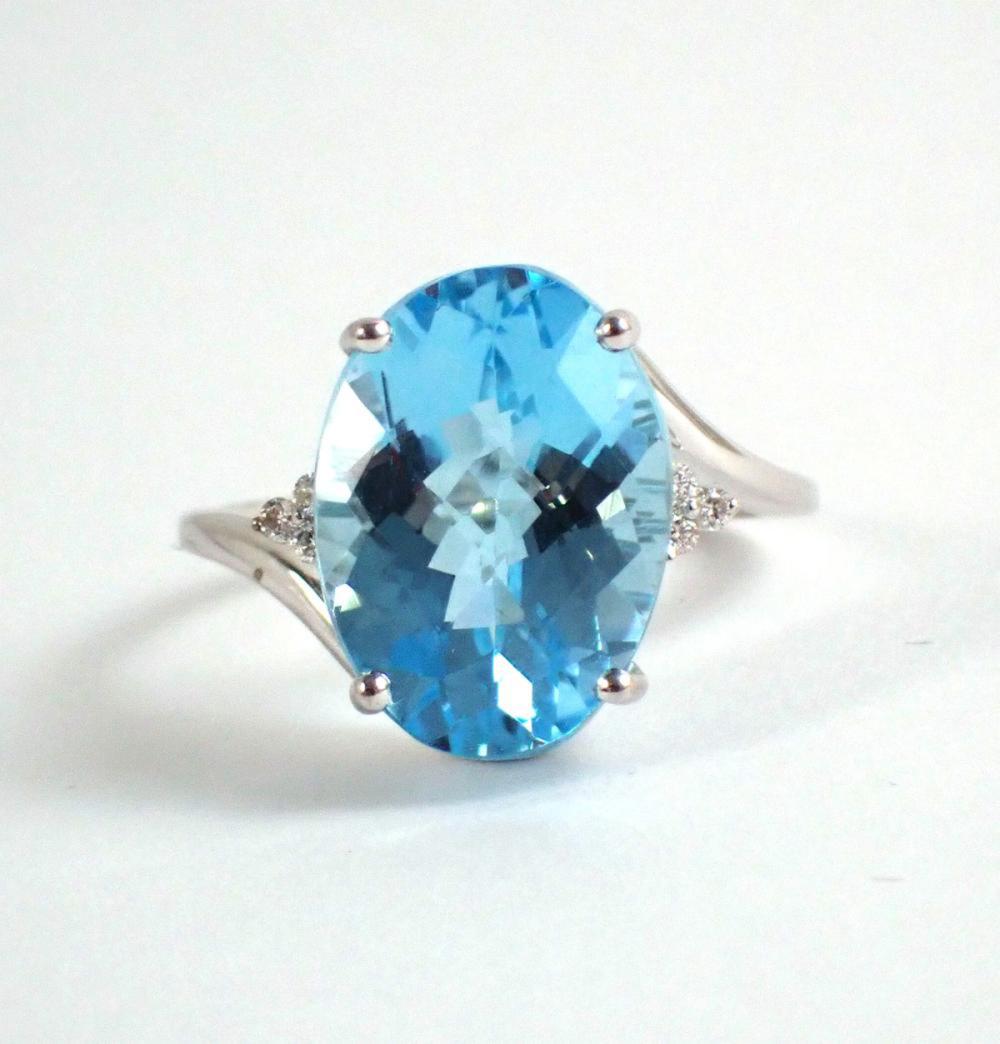 Appraisal: BLUE TOPAZ DIAMOND AND FOURTEEN KARAT GOLD RING The k