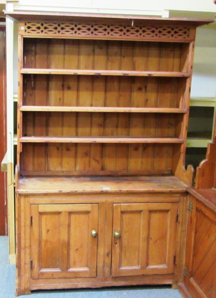 Appraisal: A th century Irish pine dresser the enclosed three tier