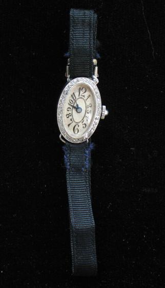 Appraisal: AN EDWARDIAN LADY'S DIAMOND COCKTAIL WATCH the oval dial with