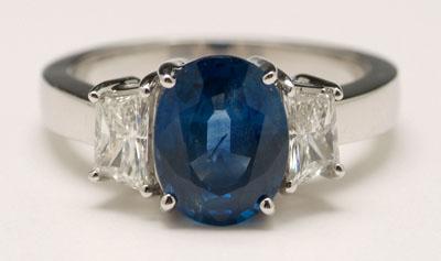 Appraisal: Sapphire diamond ring central oval blue sapphire estimated weight cts