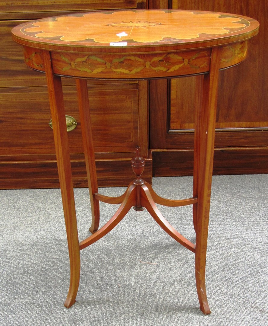 Appraisal: An early th century marquetry inlaid mahogany banded satinwood oval