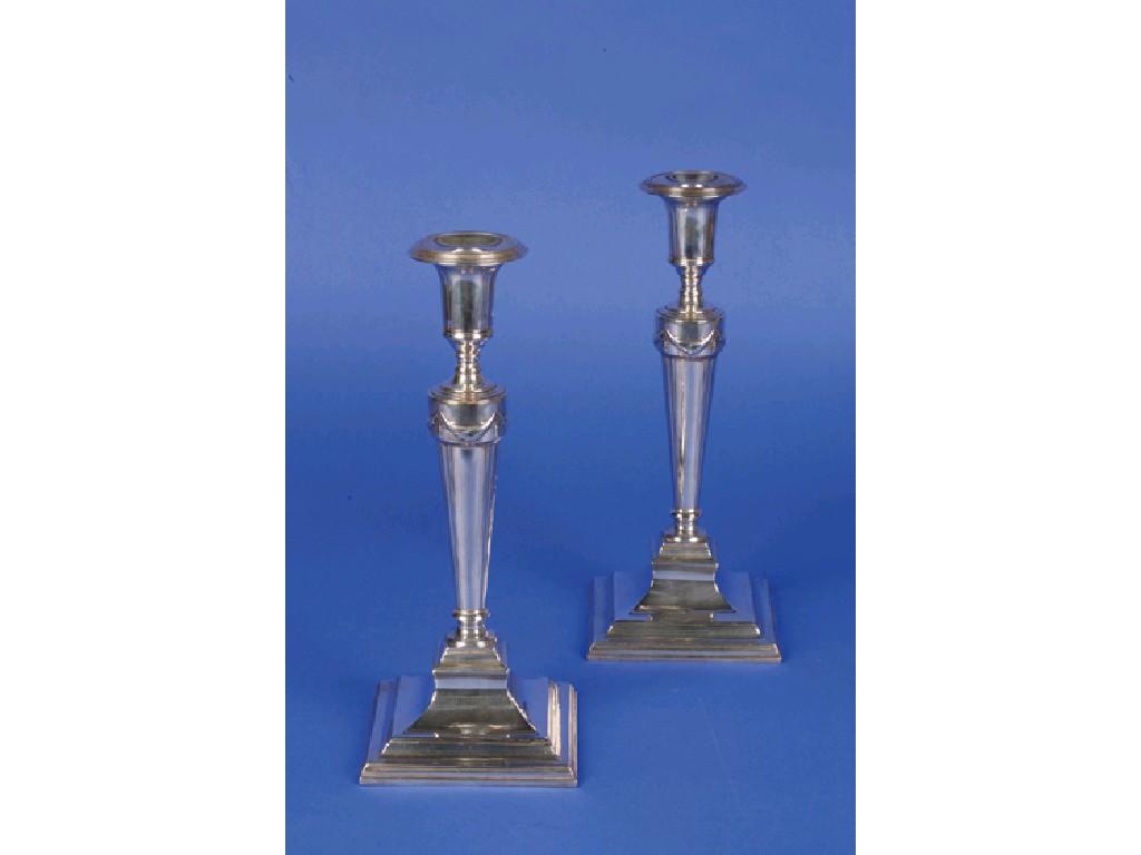 Appraisal: A PAIR OF VICTORIAN CANDLESTICKS with detachable circular sconces tapering