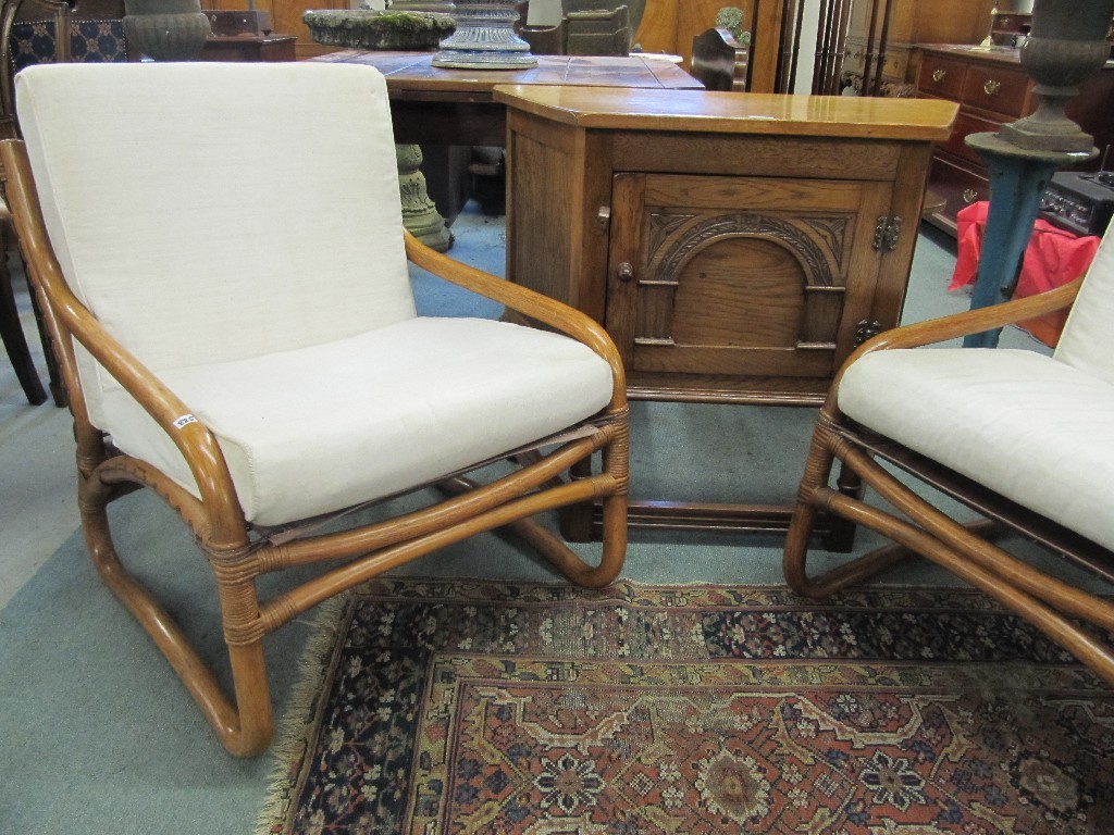 Appraisal: Oak effect side cabinet and a pair of bamboo armchairs