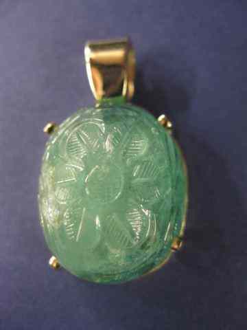 Appraisal: Carved Emerald Pendant caratcarved cabochon gem in k yellow gold