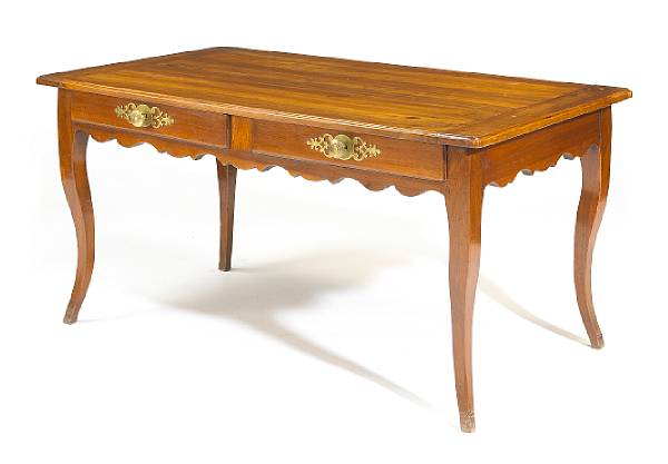 Appraisal: A Louis XV walnut bureau plat The rectangular top with