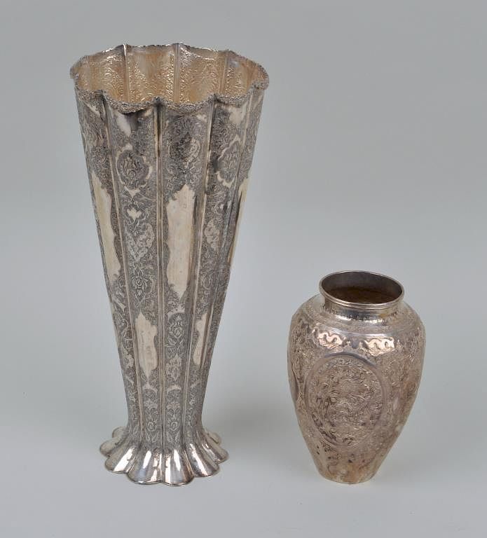 Appraisal: Two Persian Silver Engraved Vases including a ribbed trumpet form