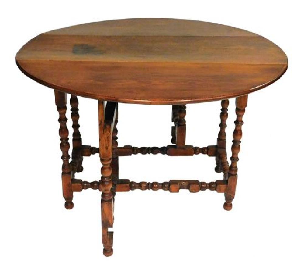 Appraisal: th C Gateleg table with bold turnings American single panel