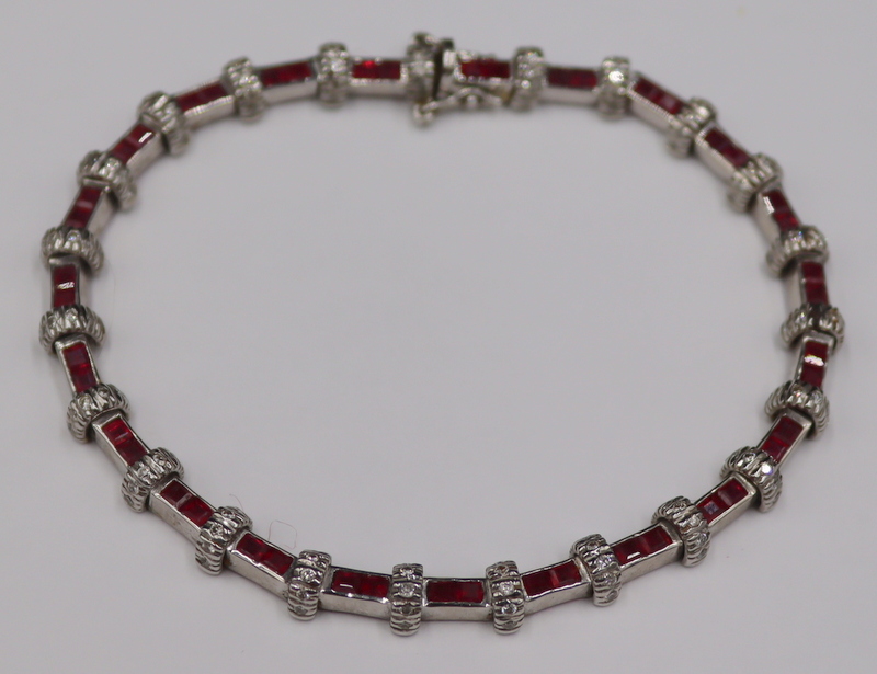 Appraisal: JEWELRY KT GOLD RUBY AND DIAMOND LINE BRACELET kt white