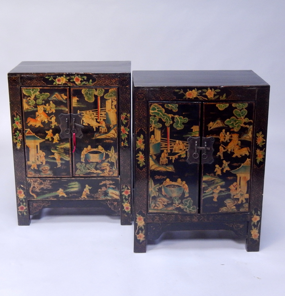 Appraisal: A pair of Chinese lacquer side cupboards each with two