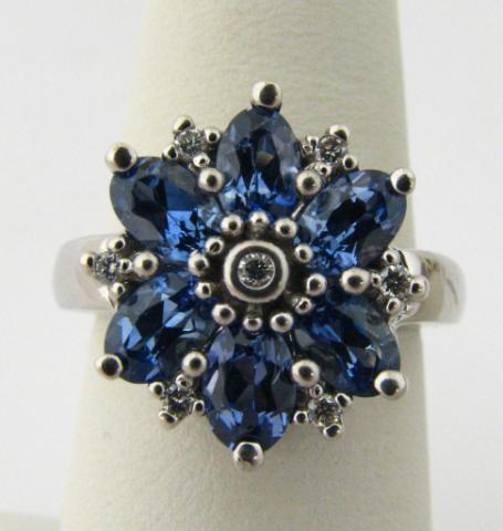 Appraisal: k white gold flower ring with oval tanzanite and diamond