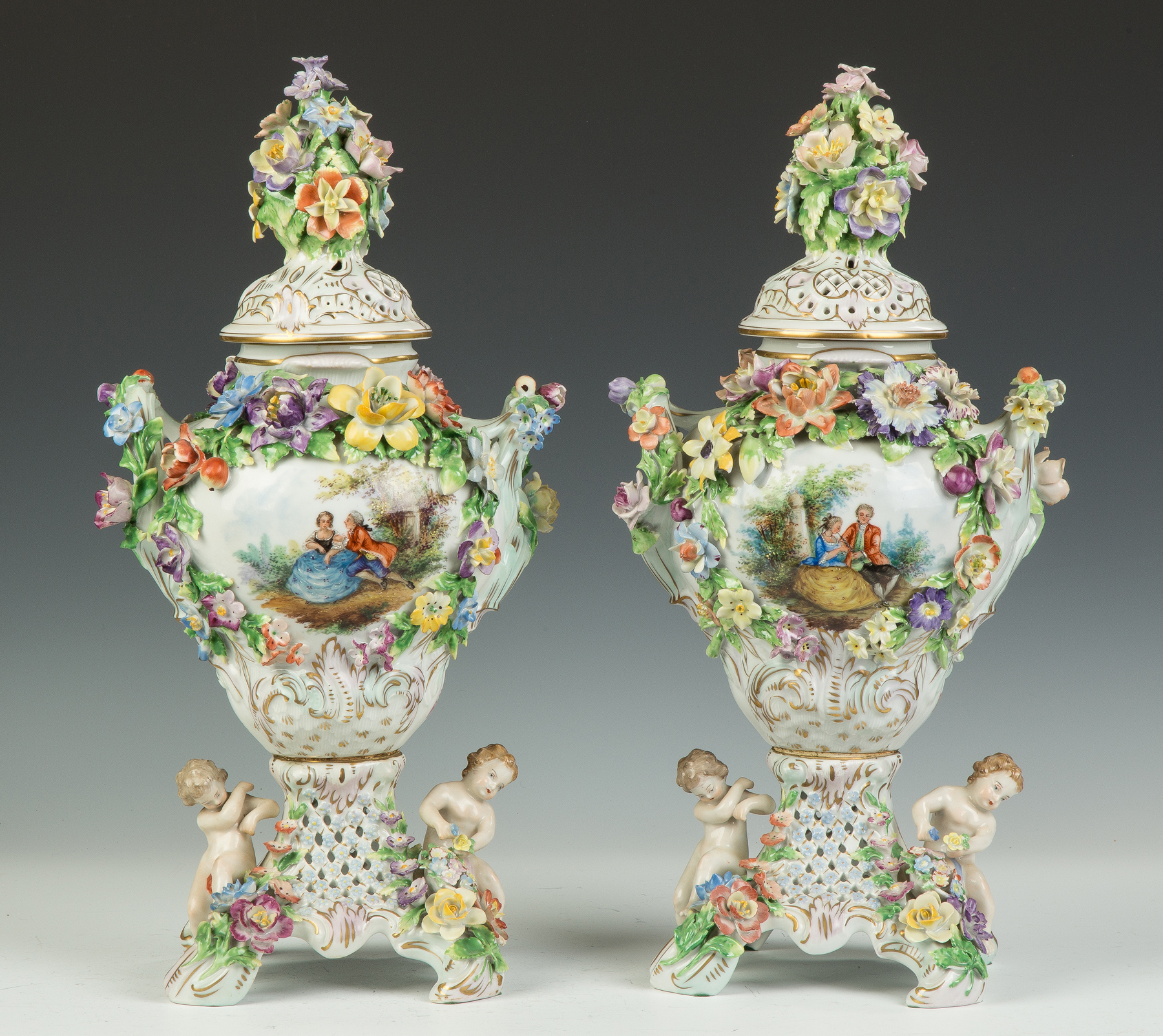 Appraisal: Pair of Dresden Urns with Courting Scenes th century Signed