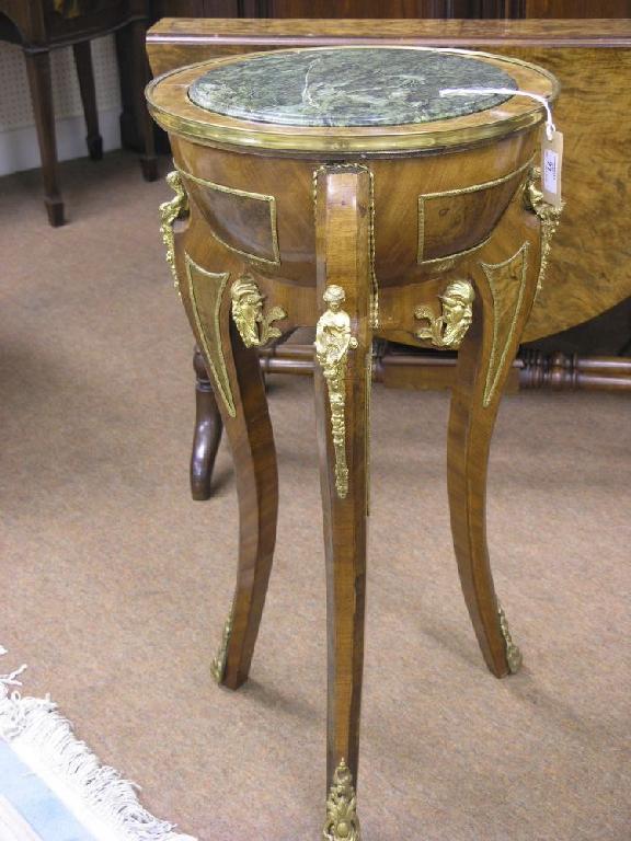 Appraisal: A French reproduction Gueridon - type walnut table with ormolu