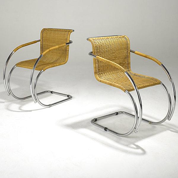 Appraisal: MIES VAN DER ROHE Pair of chrome and wicker lounge