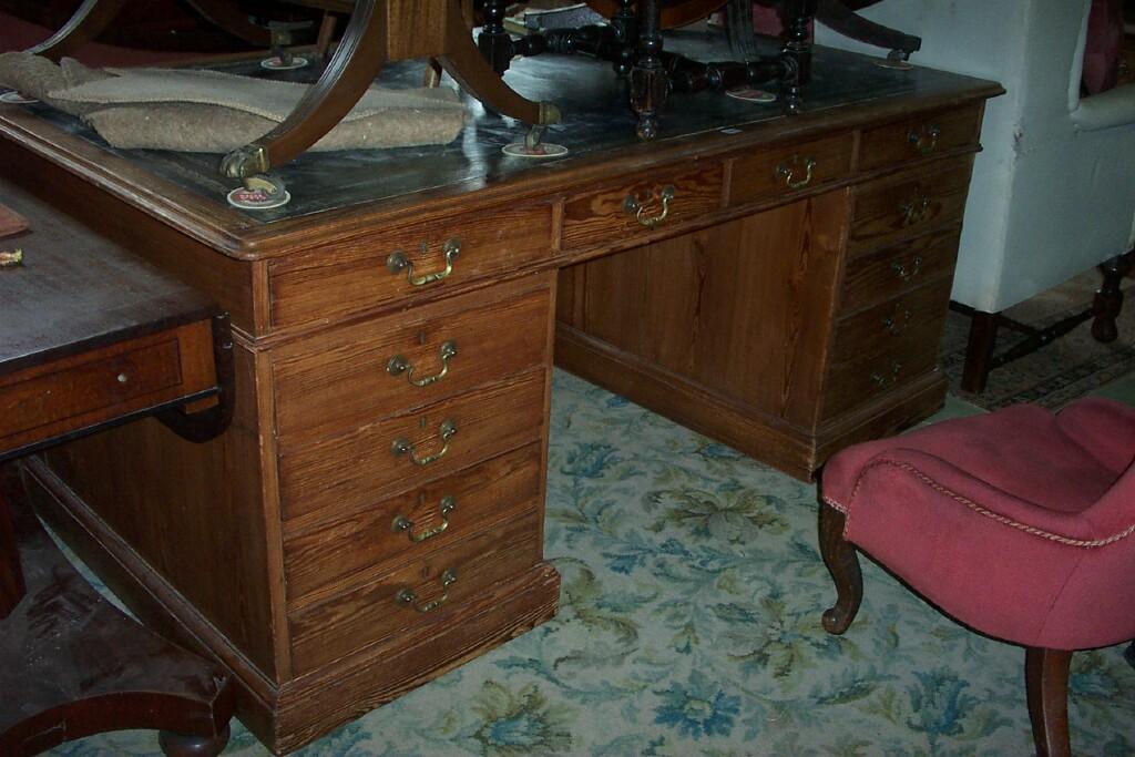 Appraisal: A large Victorian stripped and waxed pine pedestal partners desk