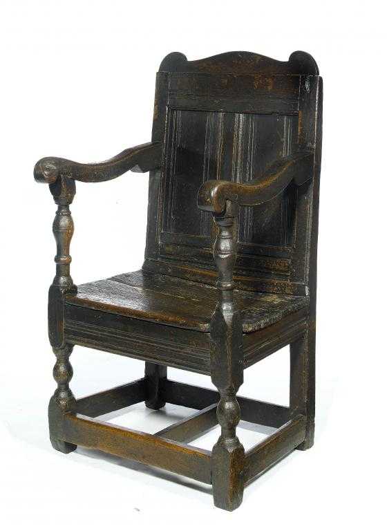 Appraisal: A CHARLES II JOINED OAK PANEL-BACK ARMCHAIR PROBABLY DERBYSHIRE the