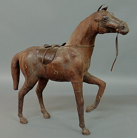 Appraisal: Leather covered full-bodied horse figure with glass eyes and English