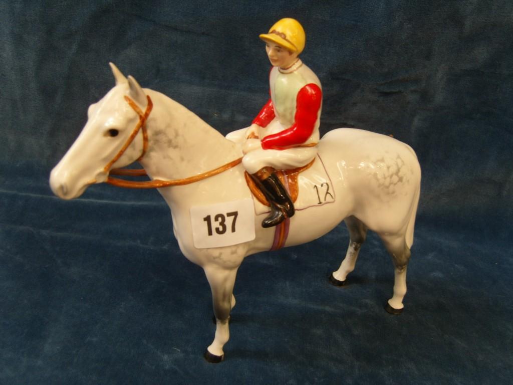 Appraisal: A Beswick model of a jockey in grey green and