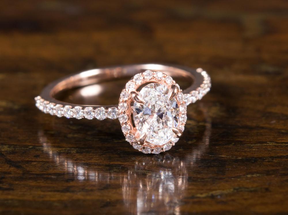 Appraisal: DIAMOND AND FOURTEEN KARAT ROSE GOLD RING with copy of