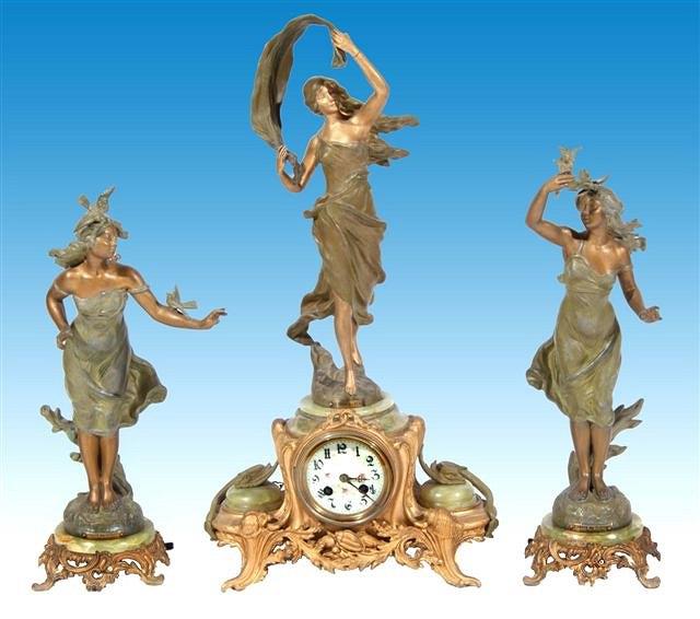 Appraisal: An Art Nouveau French spelter clock garniture de cheminee high