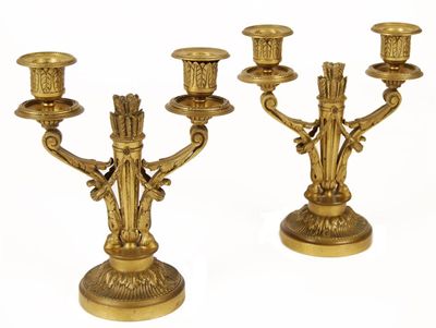 Appraisal: A pair of French gilt brass twin branch candelabra the