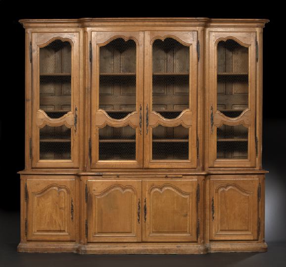 Appraisal: French Provincial Oak Breakfront mid- th century the molded and