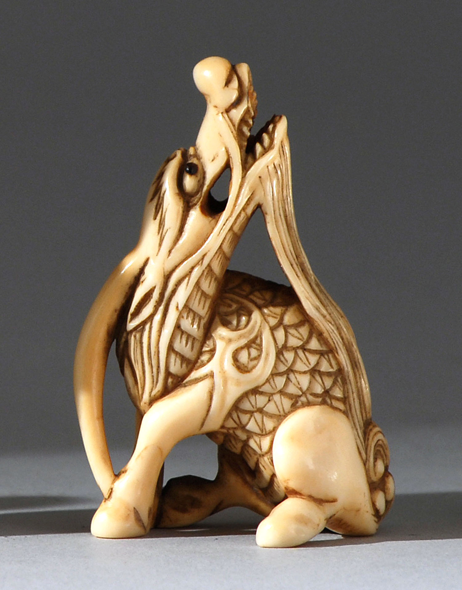 Appraisal: IVORY NETSUKE Early th CenturyIn the form of a kirin