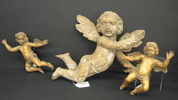 Appraisal: An Italian carved wood figure of a putto th and