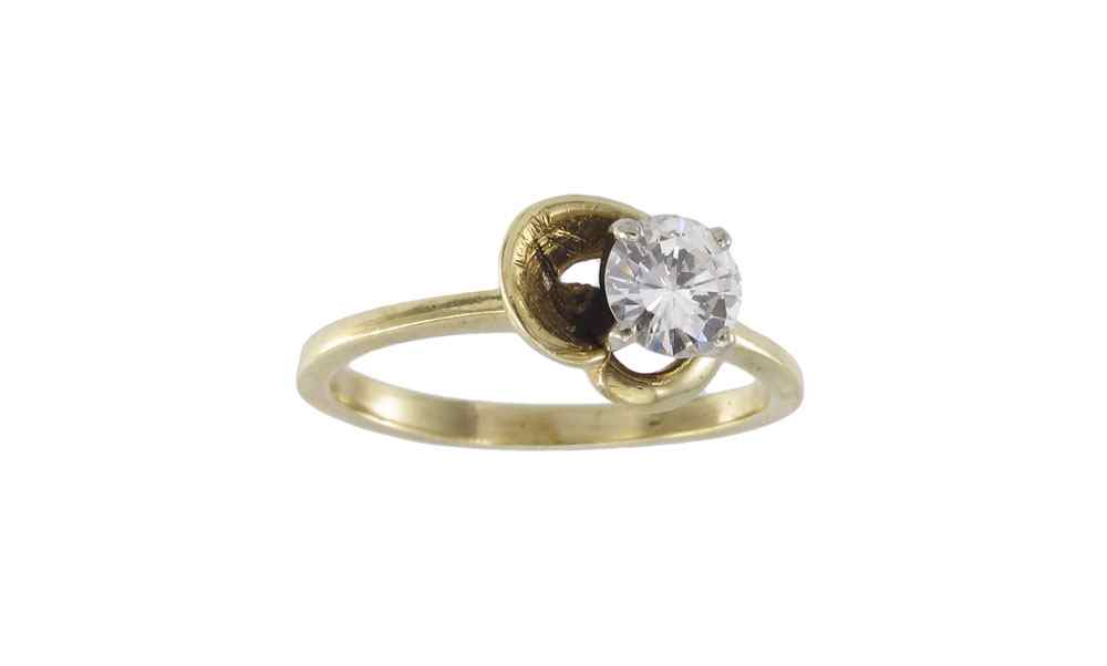 Appraisal: K GOLD AND DIAMOND RING K yellow gold ring contains