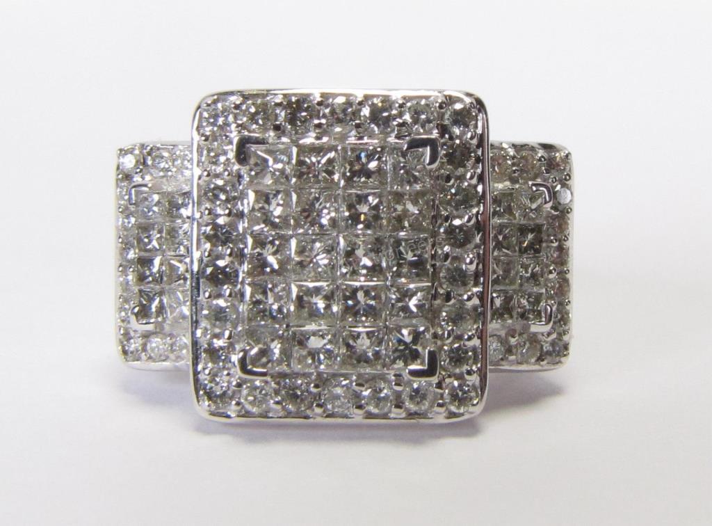 Appraisal: A K white gold ring in rectangular three-stone style mounting