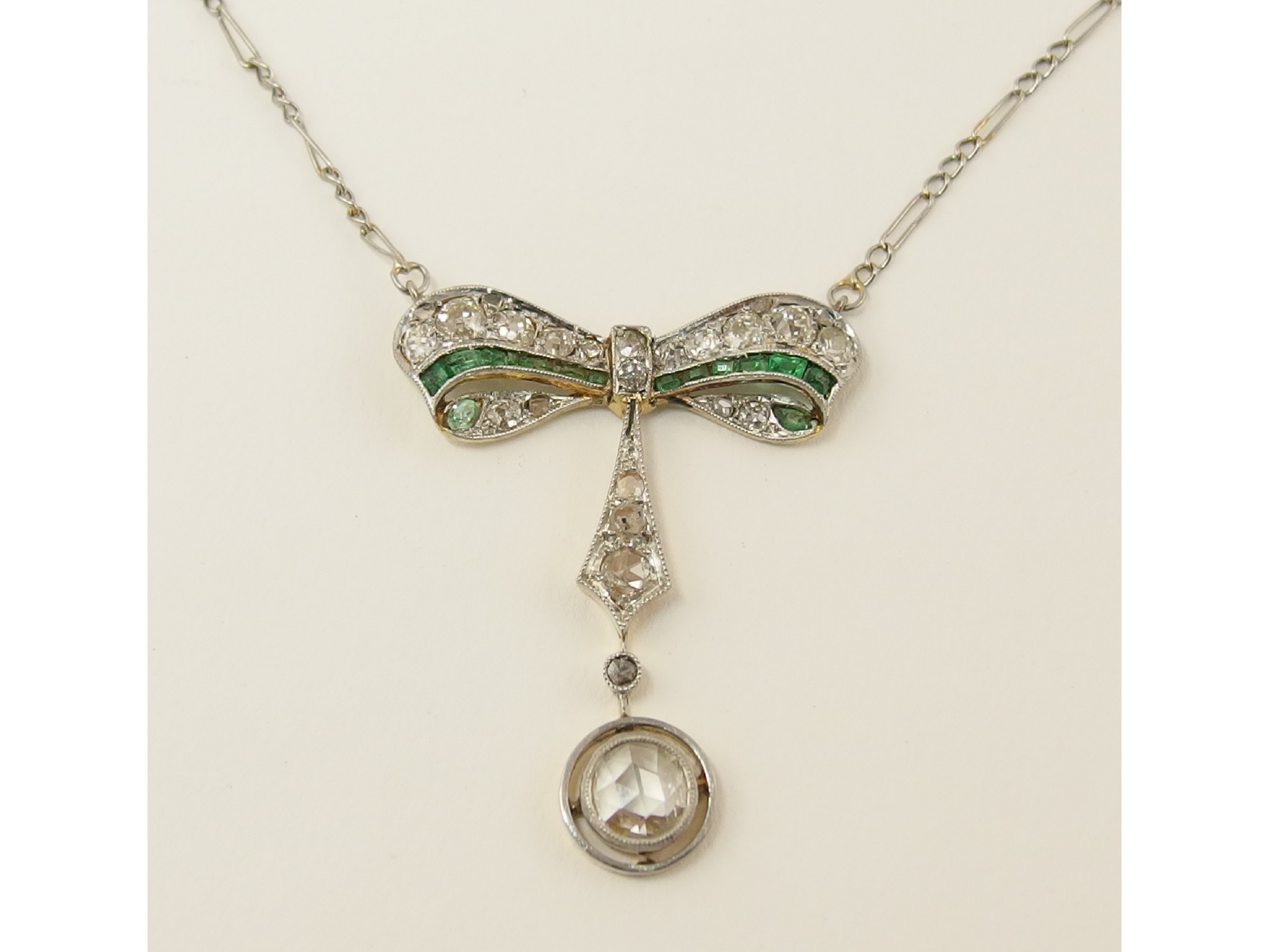 Appraisal: An Edwardian pendantin the shape of a bow set with